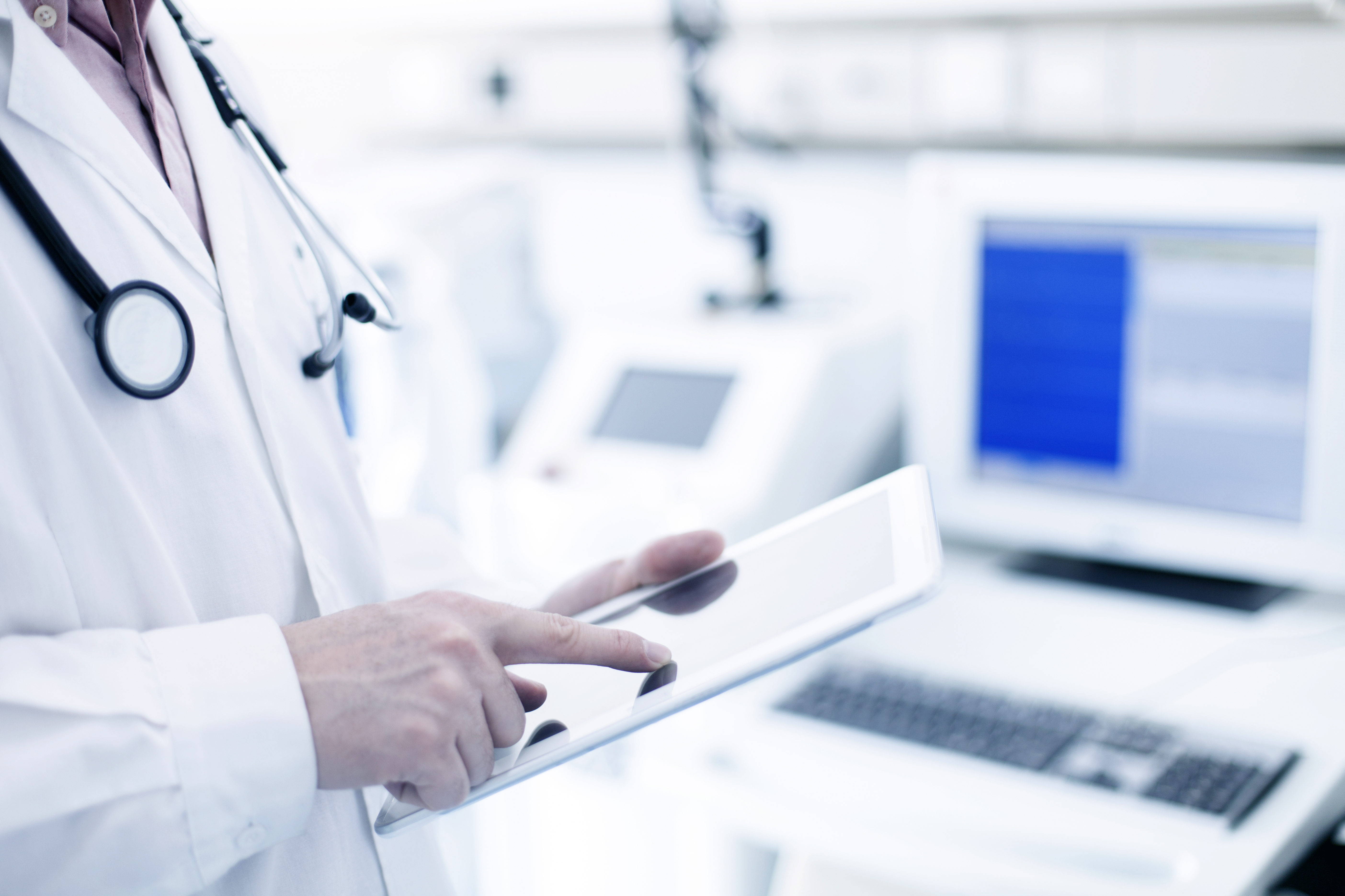 Doctor using a digital tablet